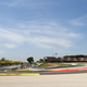 The revised Turn 10 layout. Notice the unused paved section on the inside of the red-painted surface — that’s where the cars used to run.